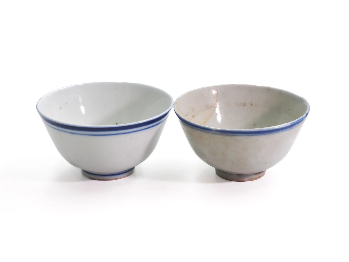 Pair of antique Late Qing Dynasty Blue Line cups side by side, showing differences in glaze tone and age patina between cups