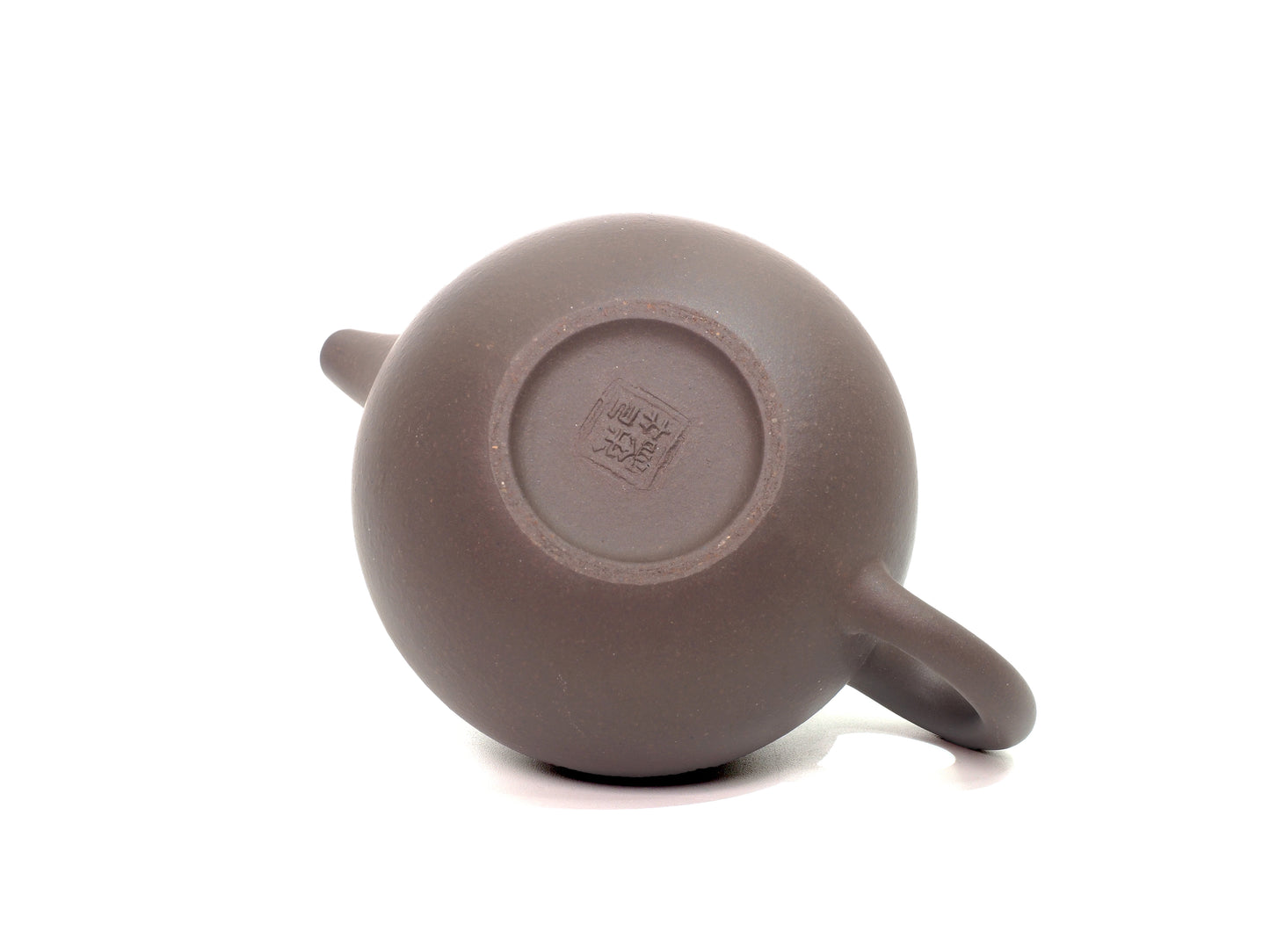 Base of Lian Zi Teapot showing artisan stamp, authenticating handmade Yixing Zisha teaware