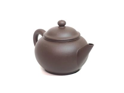 220ml Shui Ping Yixing Teapot angled right view – highlighting spout and clay texture