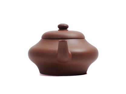 Front view of Biandeng teapot with spout centered, made of raw ore Yixing clay