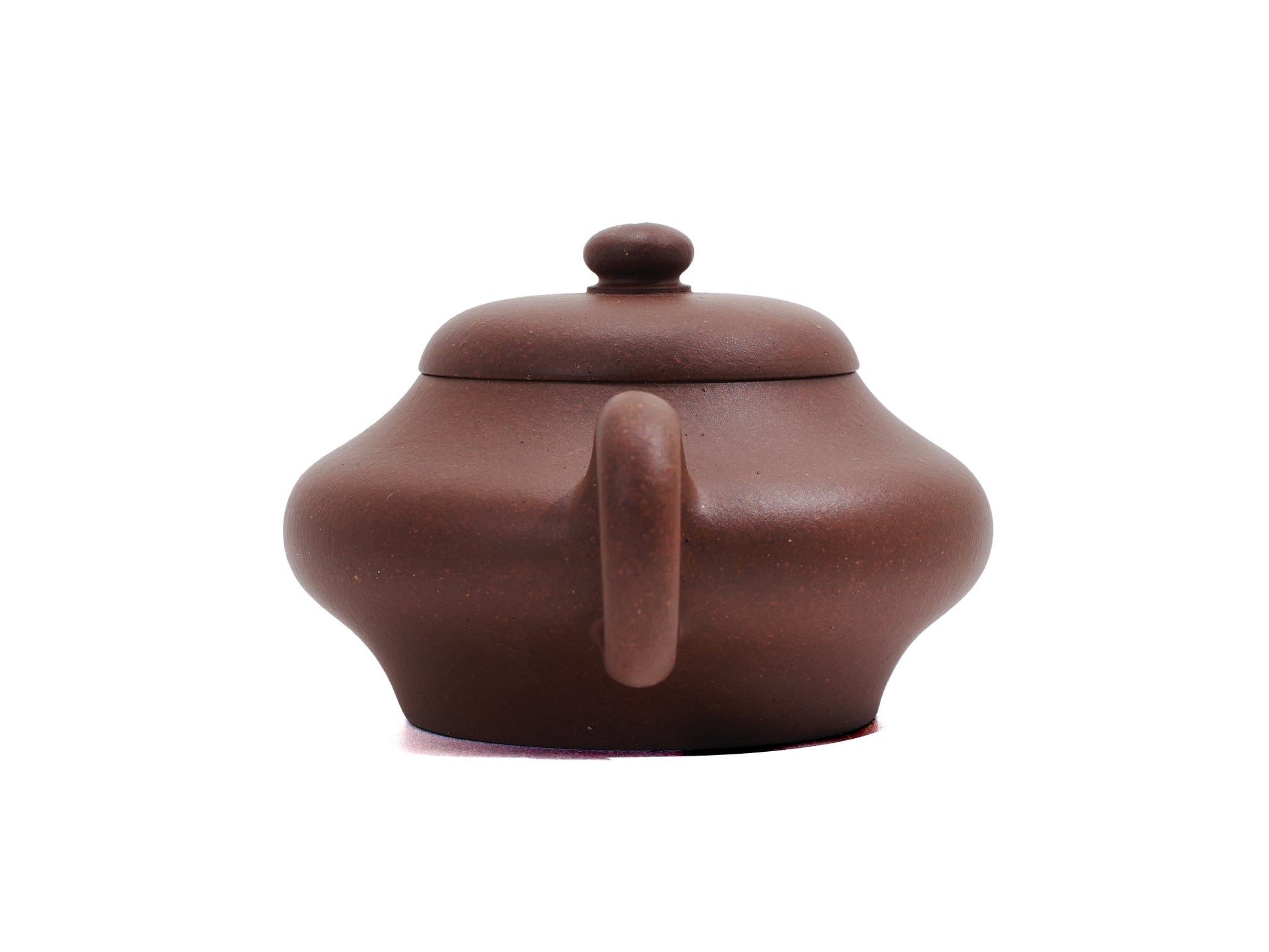 Rear view of Biandeng teapot handle and back curve design in raw ore clay