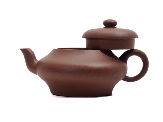 Biandeng Yixing teapot with lid raised, showcasing raw ore purple clay texture