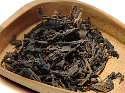 Close-up of traditionally-processed Liu Bao dry leaves — light and refined Malaysian aged profile