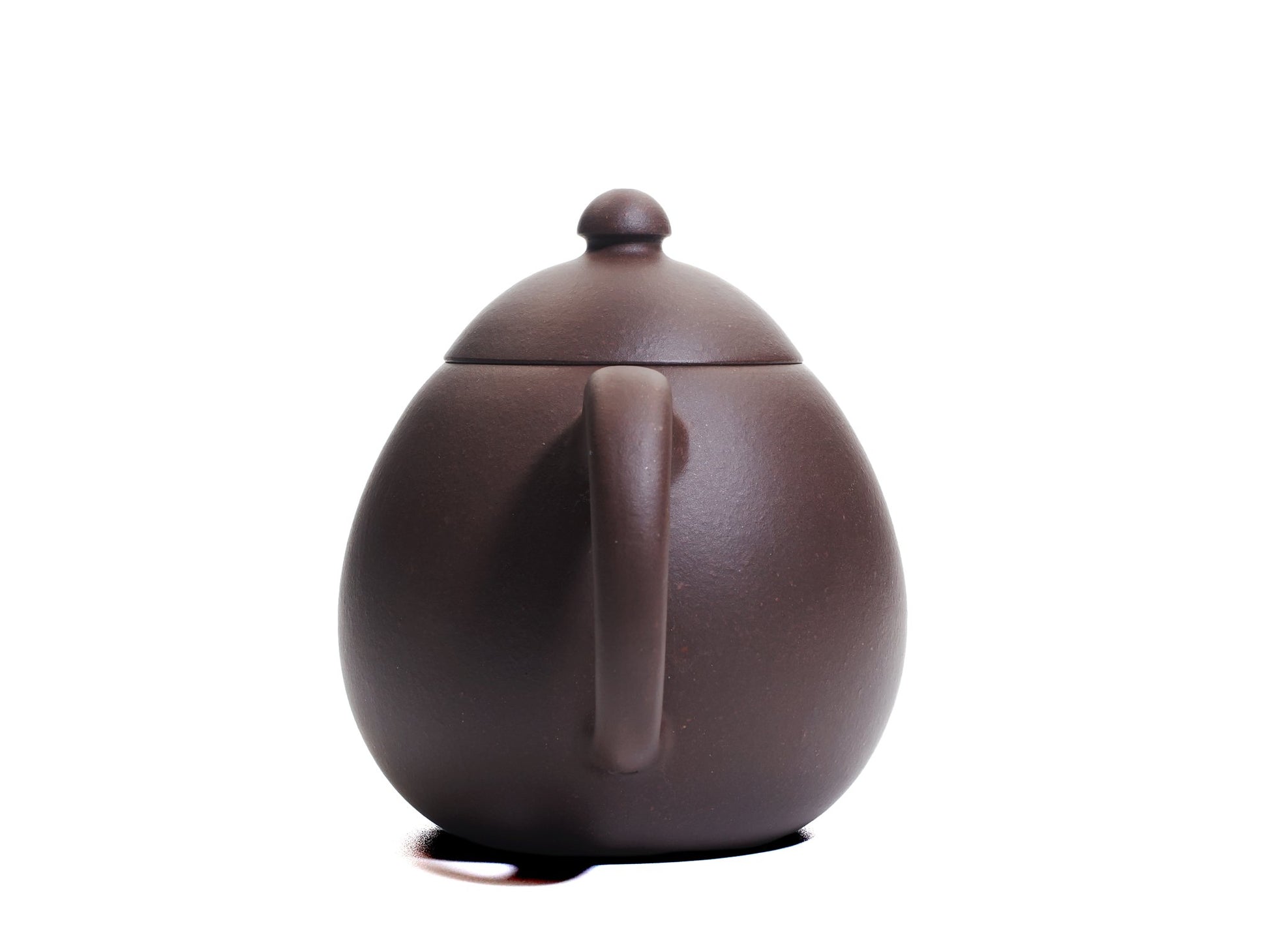 Rear view of the Da Long Dan teapot highlighting the rounded handle and balanced egg‑like silhouette.