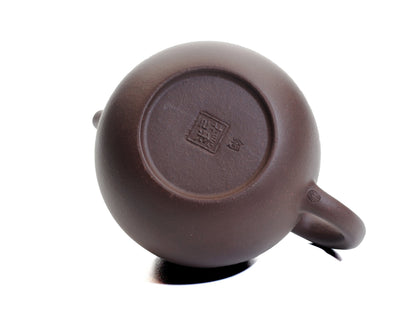 Bottom view of the Da Long Dan teapot showing the potter’s seal stamped into the base of the egg‑shaped pot.