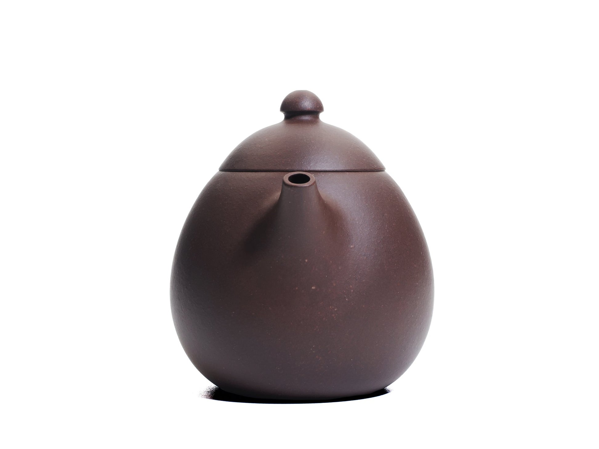 Front view of the Da Long Dan teapot showing the short spout emerging from the plump egg‑shaped body made from bronze grade clay.
