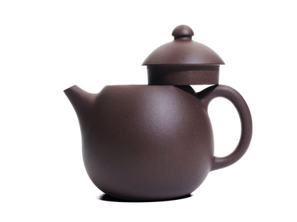 Side view of the Da Long Dan teapot with its lid removed and resting on the handle, revealing the wide opening of the 290 ml egg‑shaped pot.