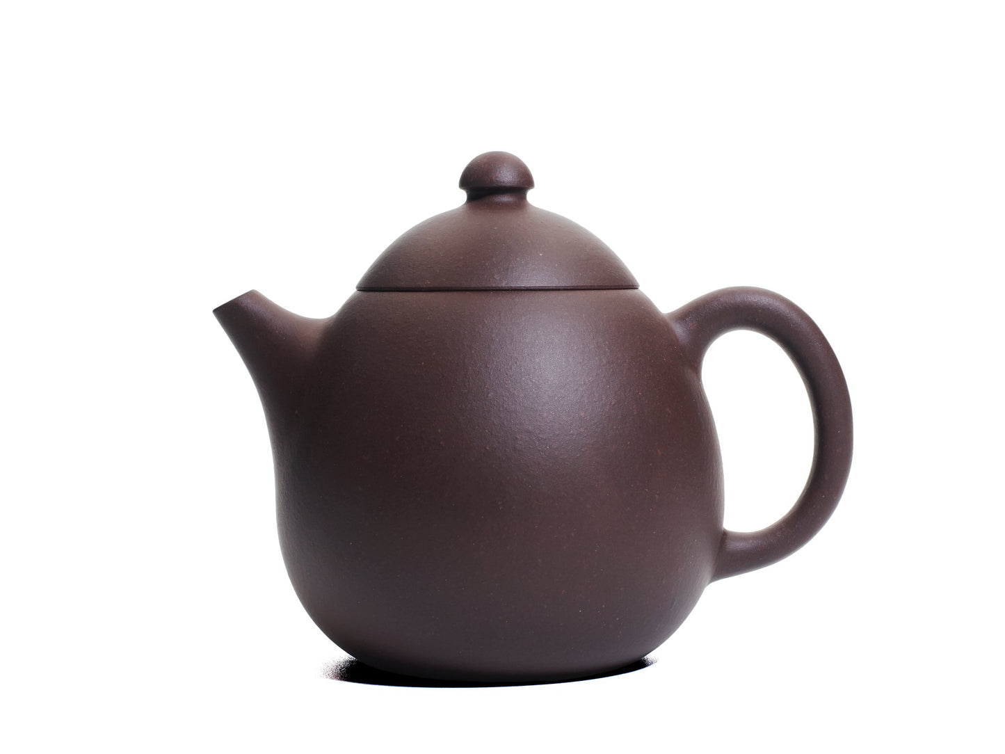 Left side view of the bronze grade Da Long Dan teapot with a gently curving spout and oval body.