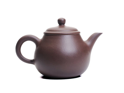Opposite side of the Da Ming Yuan Luo Han teapot showing the curved body and upward‑angled spout.