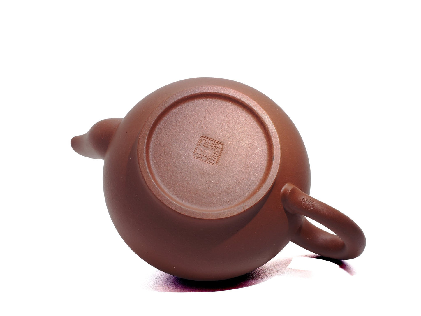 Bottom view of the Xiao Ying Hu teapot highlighting the potter’s seal impressed on the foot ring.