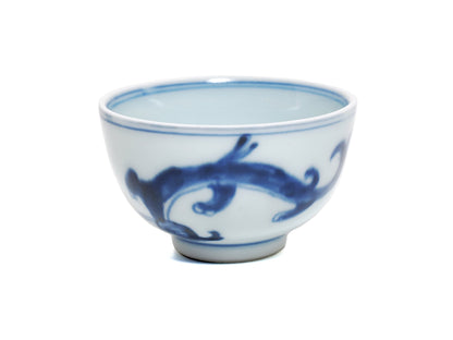 Angled side view of 1980s blue and white dragon motif teacup