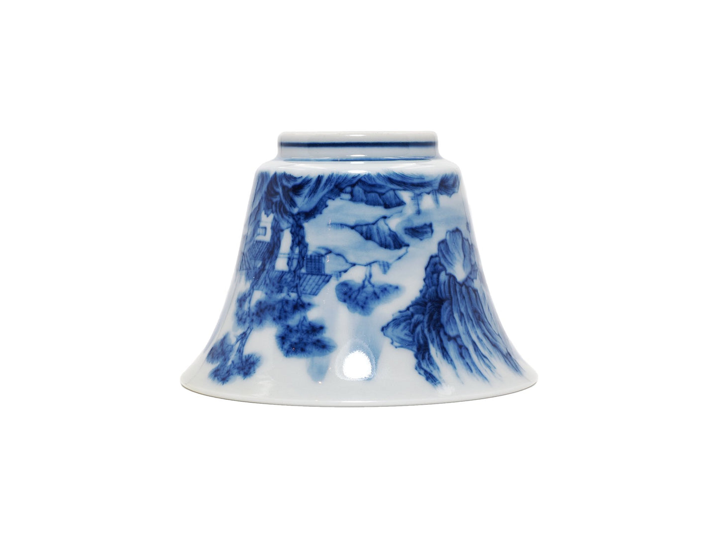 Upside down view of blue and white landscape teacup with wood kiln finish