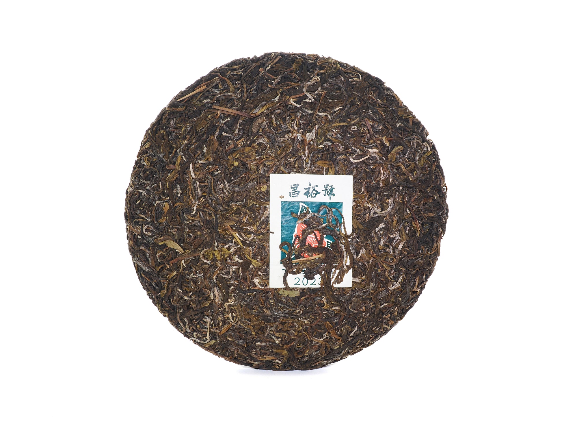 Unwrapped Jingmai Zhengshan 2023 tea cake with embedded ticket