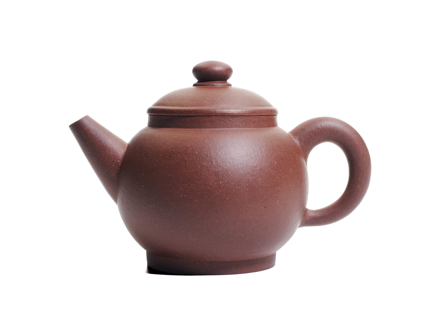 Side view of the Ju Lun Zhu Yixing teapot showing its round diamond‑grade purple clay body, short spout and looped handle.