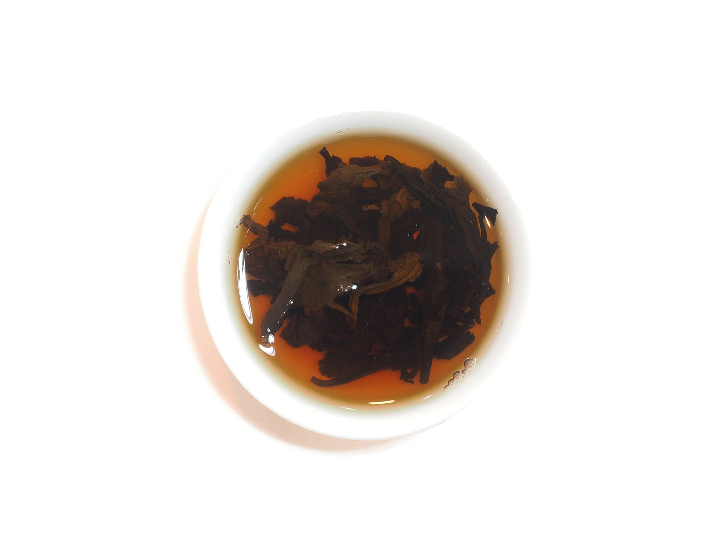 Steeping Yongchun Shui Xian leaves showing liquor color and leaf shape