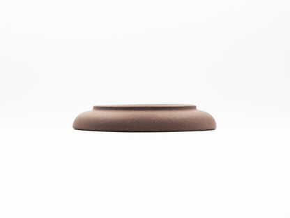 Elevated base view of special grade Lao Zini tea coaster with smooth curve