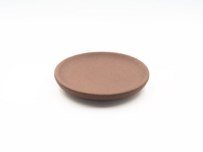 Top view of Lao Zini Dehou tea coaster in round minimalist design