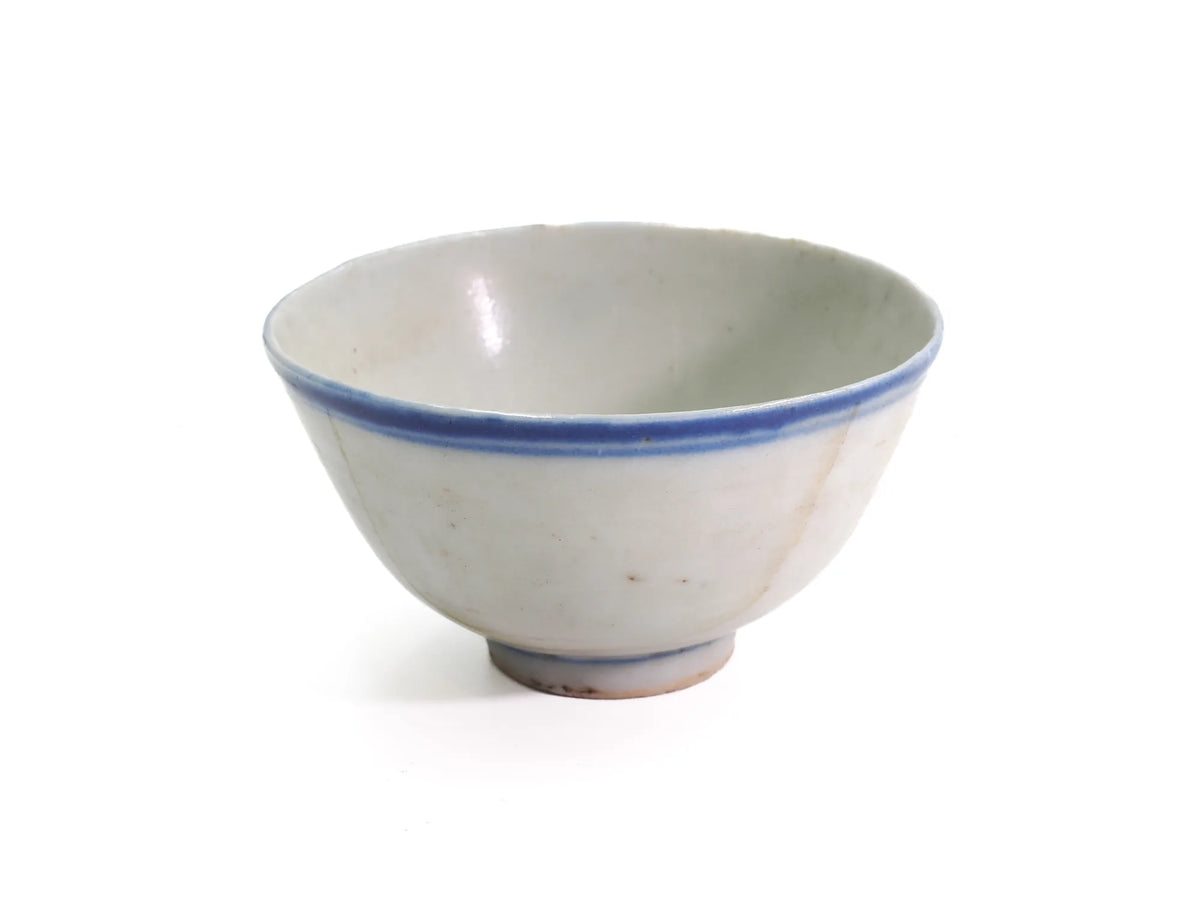 Three-quarter view of an antique Late Qing Dynasty Blue Line cup showing the pale celadon-tinted interior and blue line rim