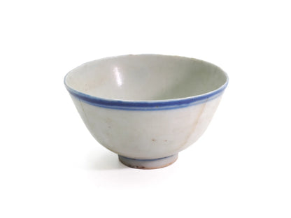 Three-quarter view of an antique Late Qing Dynasty Blue Line cup showing the pale celadon-tinted interior and blue line rim
