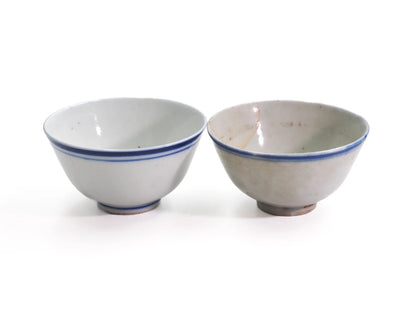 Pair of antique Late Qing Dynasty Blue Line cups side by side, showing differences in glaze tone and age patina between cups