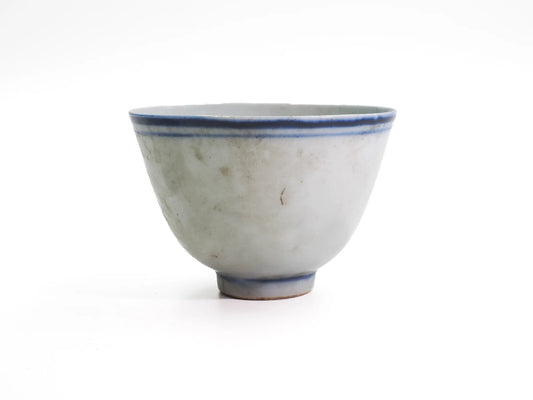 Front view of an antique large Late Qing Dynasty Blue Line cup with tall flared profile, double blue rim lines and aged glaze surface