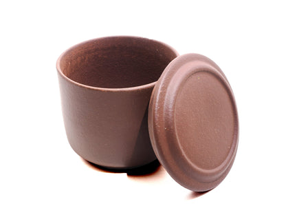 Mini Yixing tea jar opened with lid resting beside