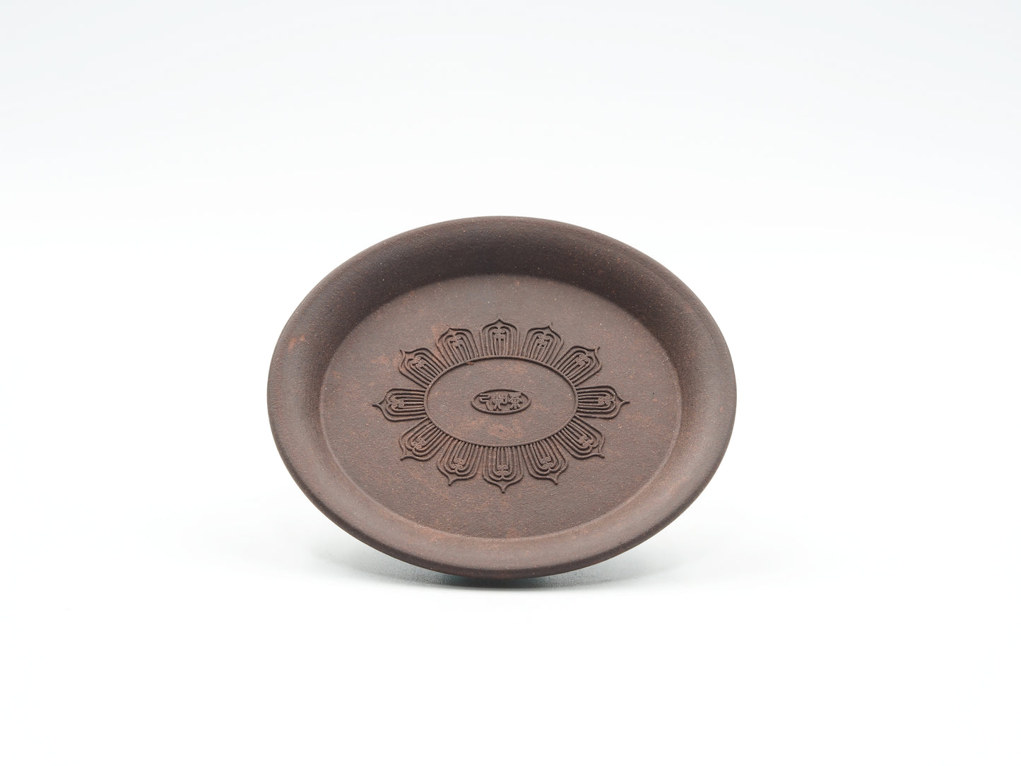 Front view of Oval Yixing Tea Coaster showing carved lotus flower design
