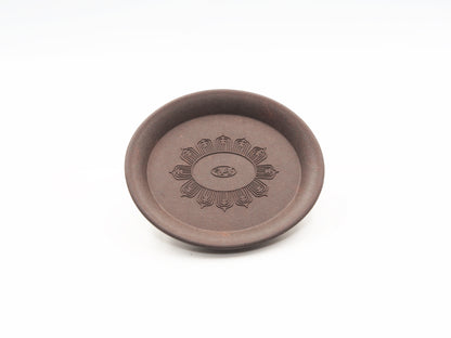 Top-down view of the Yixing Tea Coaster showing lotus flower carving in full