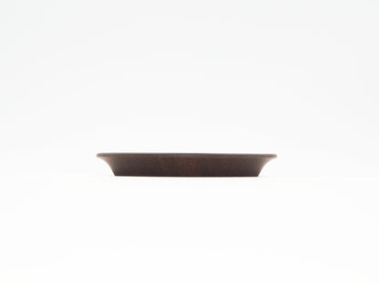 Side profile of the Oval Yixing Tea Coaster showing elegant curves and flat design