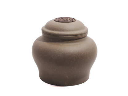 Angled view showing lid with engraved Shou character on Yixing tea jar