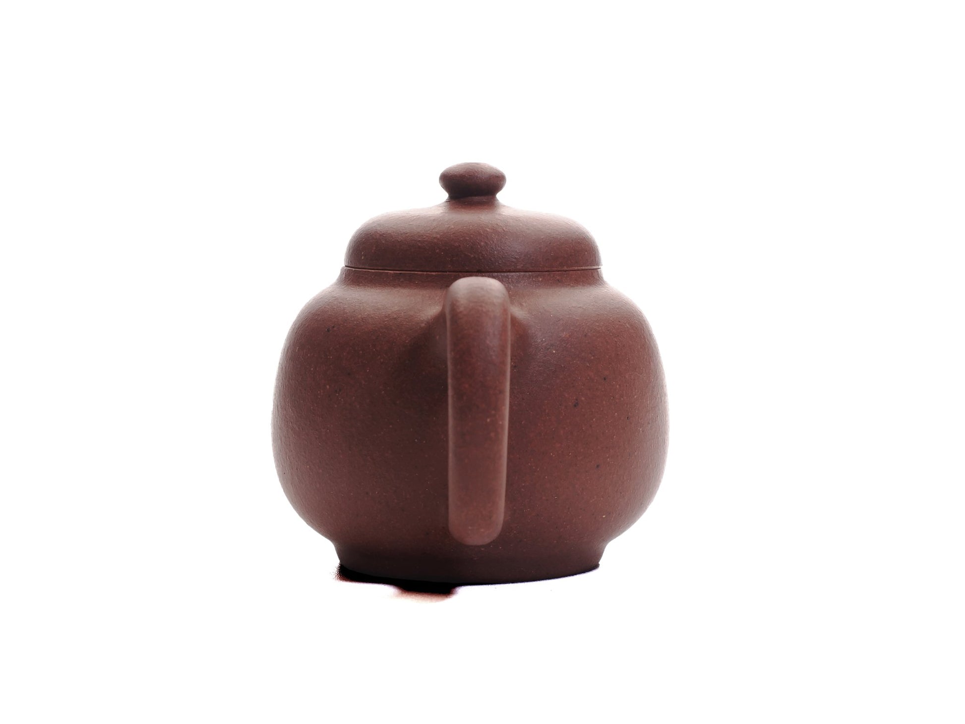 Back view of the Xiao Da Bin 50 ml diamond‑grade Yixing teapot showing the rounded handle and smooth purple clay finish.