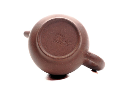 Base of the Xiao Da Bin 50 ml Yixing teapot showing the artisan’s seal stamped into the diamond‑grade purple clay.