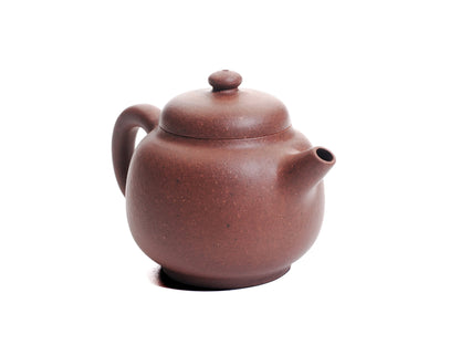 Front‑right view of the Xiao Da Bin teapot highlighting the short spout and balanced silhouette of the 50 ml diamond‑grade purple clay.