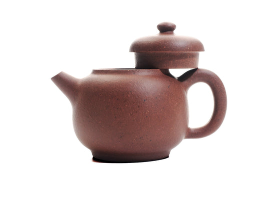 Handmade Xiao Da Bin Yixing teapot with lid removed, showing the 50 ml diamond‑grade purple clay body and ergonomic handle.