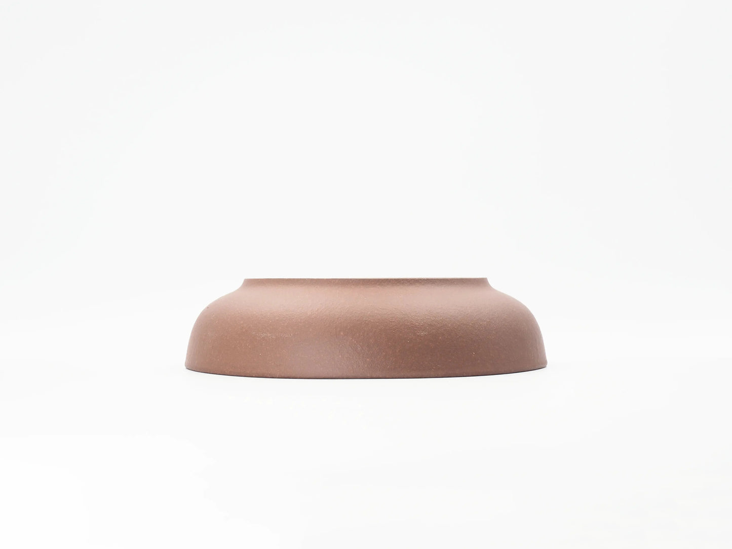Angled view of the Yixing clay tea boat's base and footring