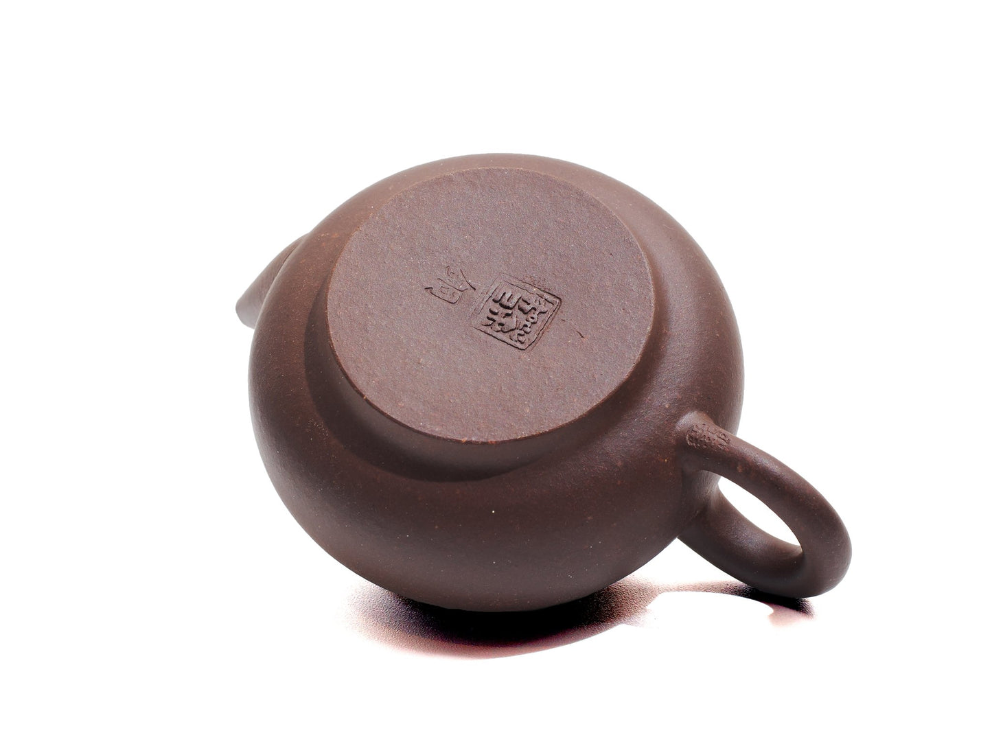 Bottom stamp of Cha Zhi Ji Junde Yixing teapot crafted from bronze grade purple clay