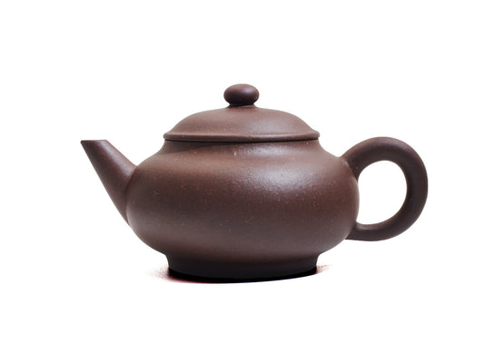 Right side view of Cha Zhi Ji Junde Yixing teapot in bronze grade purple cla