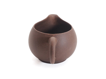 Yixing zisha cha hai fairness pitcher, three-quarter front view in unglazed purple clay
