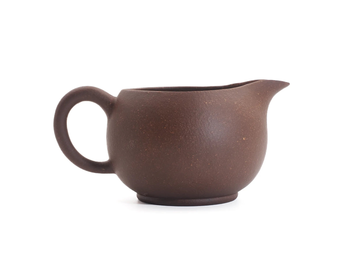 Side profile of the handmade zisha cha hai, spout left and handle right