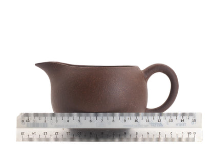 Yixing zisha fairness pitcher measured against a ruler, about 13 cm spout to handle